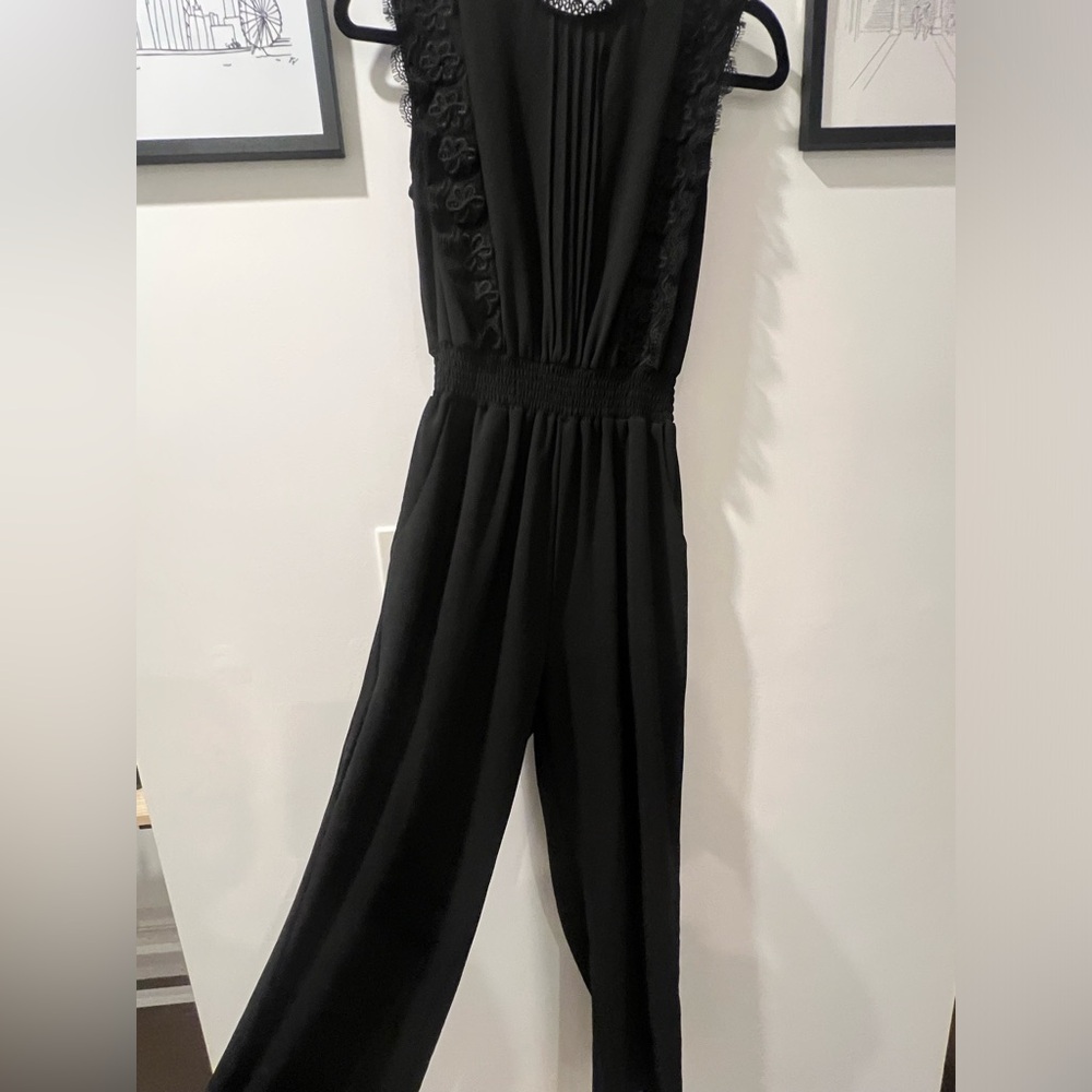 Black jumpsuit with open back cutout